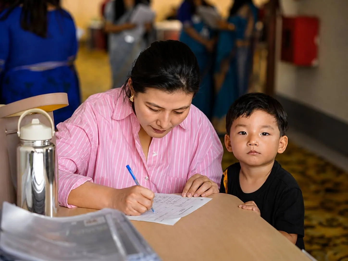 Teacher supporting a student in class